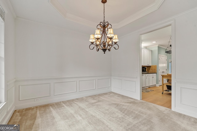 1210 Magnolia Park Cir, Cumming, GA 30040 - empty room with a chandelier, crown molding, a wainscoted wall, a tray ceiling, and a decorative wall
