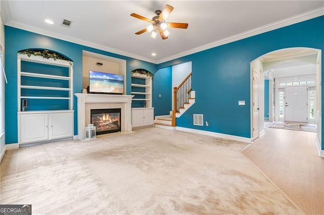 1210 Magnolia Park Cir, Cumming, GA 30040 - unfurnished living room with crown molding, a fireplace with flush hearth, ceiling fan, baseboards, and built in features