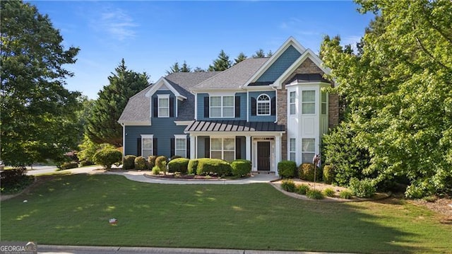 1210 Magnolia Park Cir, Cumming, GA 30040 - view of front of house with a front yard, a standing seam roof, and metal roof