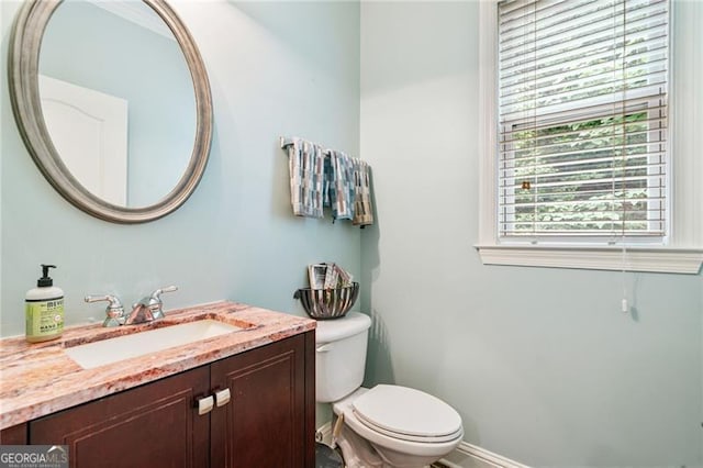 1210 Magnolia Park Cir, Cumming, GA 30040 - half bathroom with toilet, vanity, and baseboards