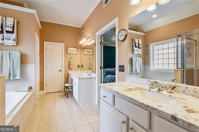 1210 Magnolia Park Cir, Cumming, GA 30040 - full bathroom with vanity, a garden tub, tile patterned flooring, a shower stall, and connected bathroom