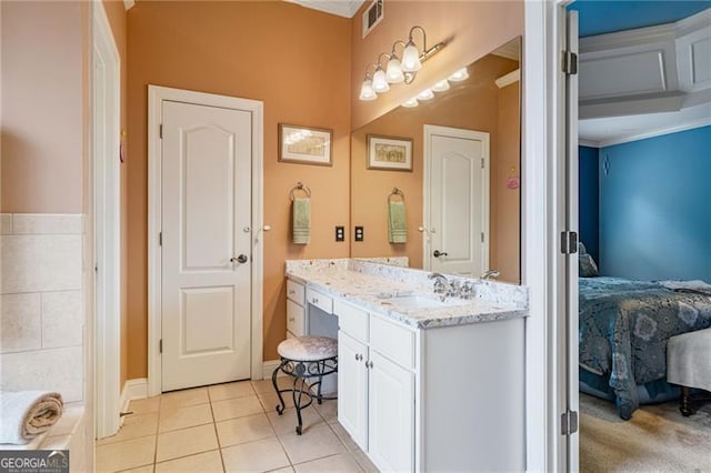 1210 Magnolia Park Cir, Cumming, GA 30040 - ensuite bathroom featuring vanity, tile patterned floors, ornamental molding, and baseboards
