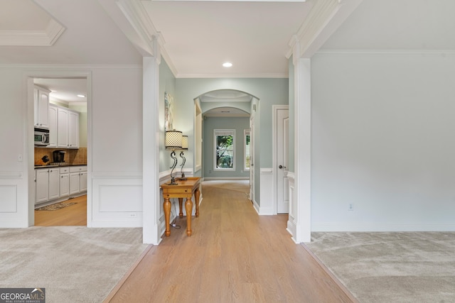 1210 Magnolia Park Cir, Cumming, GA 30040 - hallway featuring arched walkways, crown molding, light wood-style floors, and recessed lighting