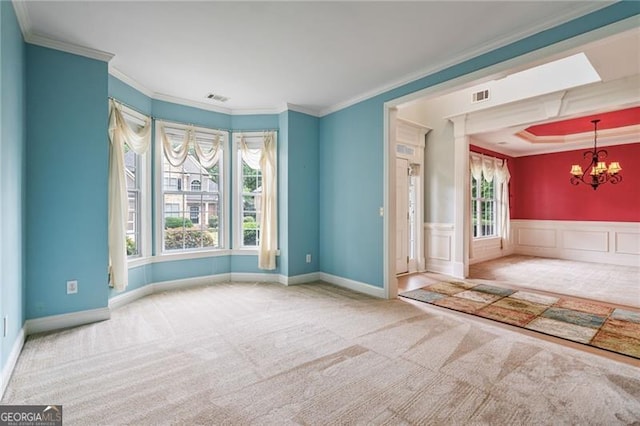 1210 Magnolia Park Cir, Cumming, GA 30040 - carpeted empty room featuring a chandelier, crown molding, and wainscoting