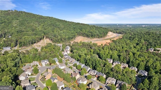 1210 Magnolia Park Cir, Cumming, GA 30040 - view of property location featuring a forest and nearby suburban area