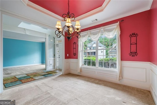 1210 Magnolia Park Cir, Cumming, GA 30040 - carpeted foyer entrance featuring a chandelier, crown molding, a wainscoted wall, a tray ceiling, and a decorative wall