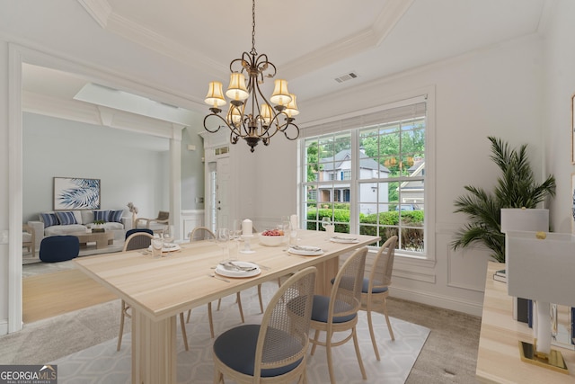 1210 Magnolia Park Cir, Cumming, GA 30040 - dining space featuring ornamental molding, a chandelier, a decorative wall, and wainscoting