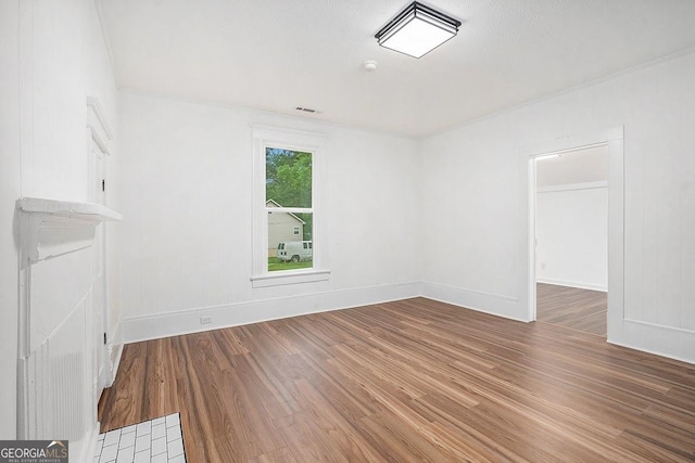 1852 Burwell Rd, Carrollton, GA 30117 - empty room with wood finished floors, baseboards, and a smoke detector