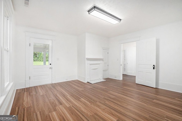 1852 Burwell Rd, Carrollton, GA 30117 - unfurnished living room with wood finished floors and baseboards