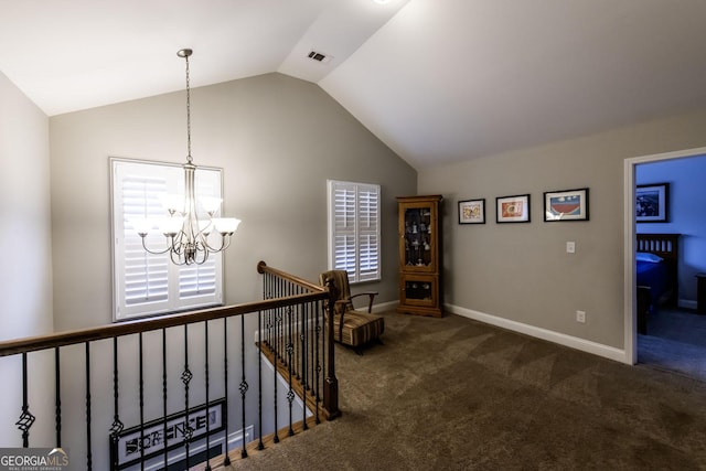 101 High Bluff Trl, Carrollton, GA 30116 - hallway with a chandelier, lofted ceiling, carpet, an upstairs landing, and baseboards
