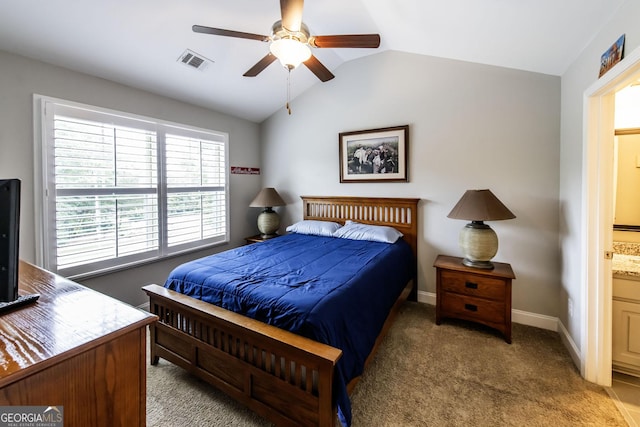 101 High Bluff Trl, Carrollton, GA 30116 - bedroom with light colored carpet, vaulted ceiling, ensuite bath, baseboards, and a ceiling fan