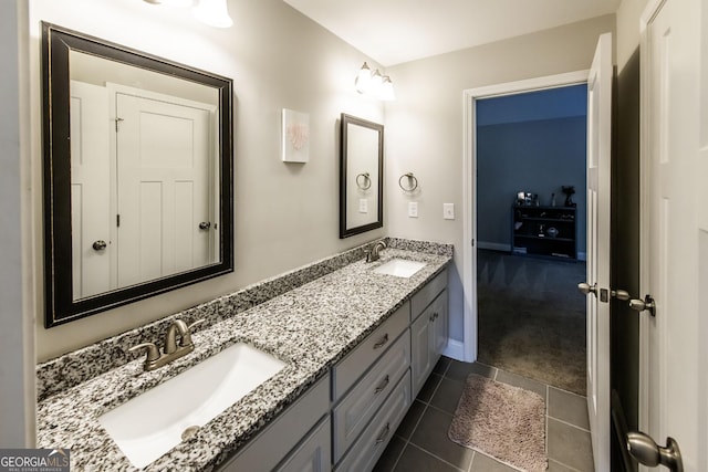 101 High Bluff Trl, Carrollton, GA 30116 - bathroom featuring double vanity, tile patterned flooring, and baseboards