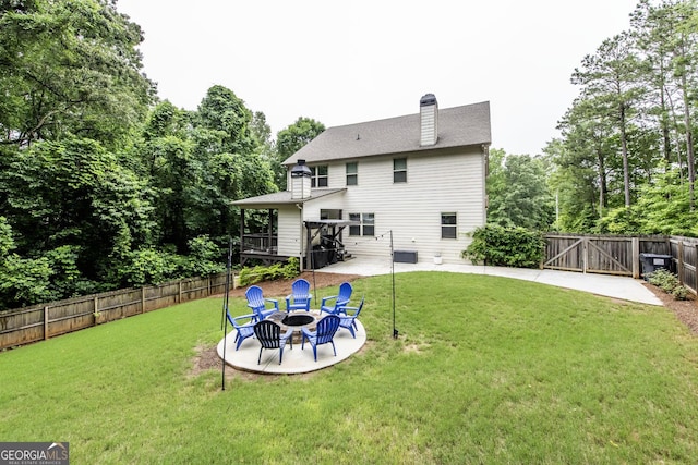 101 High Bluff Trl, Carrollton, GA 30116 - rear view of property with a gate, a wooden deck, a patio, a chimney, and a fire pit