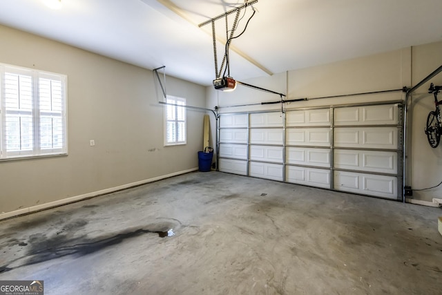 101 High Bluff Trl, Carrollton, GA 30116 - garage featuring a garage door opener and baseboards