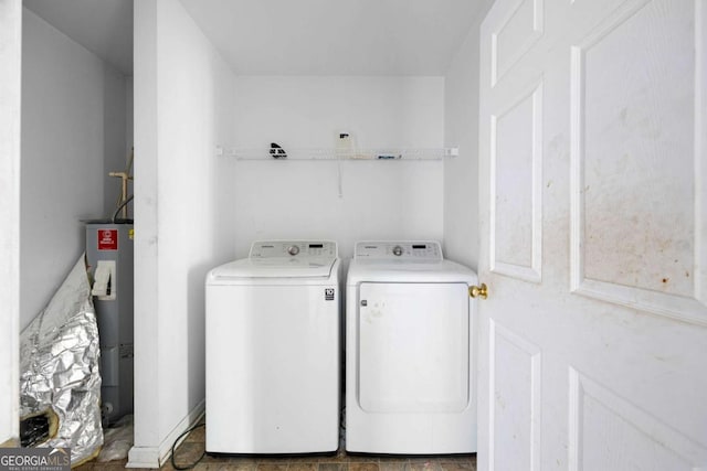 6770 Gordon Manor Ct SW, Mableton, GA 30126 - laundry area with washing machine and dryer and water heater