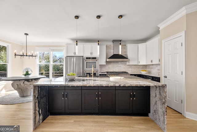 410 S Burgess Trl, Milton, GA 30004 - kitchen with wall chimney exhaust hood, appliances with stainless steel finishes, white cabinets, backsplash, and light stone counters
