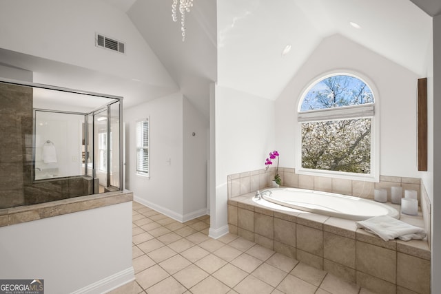 410 S Burgess Trl, Milton, GA 30004 - bathroom with a garden tub, tile patterned floors, high vaulted ceiling, a shower, and baseboards