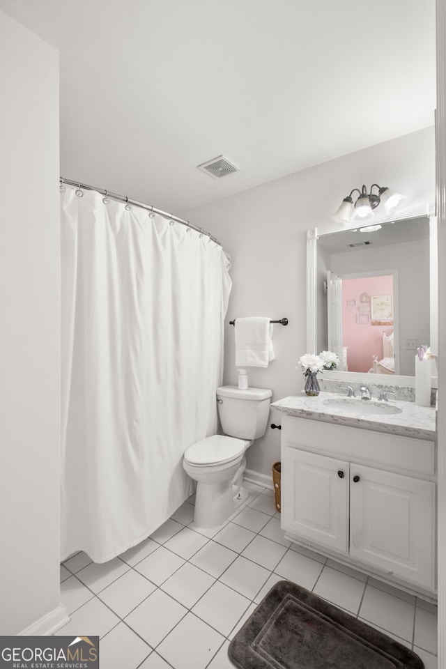 410 S Burgess Trl, Milton, GA 30004 - bathroom featuring vanity, toilet, tile patterned flooring, and baseboards