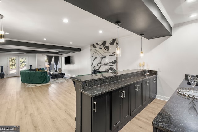 410 S Burgess Trl, Milton, GA 30004 - kitchen featuring crown molding, dark cabinetry, light wood-style floors, recessed lighting, and dark stone counters