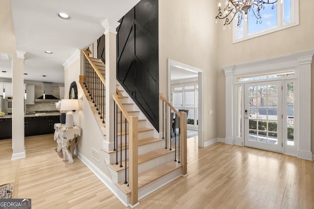 410 S Burgess Trl, Milton, GA 30004 - foyer featuring stairs, light wood finished floors, a chandelier, baseboards, and recessed lighting