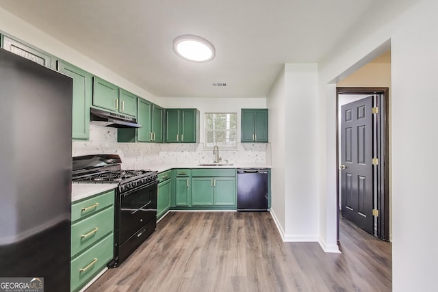 131 Turning Pt, Stockbridge, GA 30281 - kitchen featuring black appliances, green cabinets, a sink, under cabinet range hood, and wood finished floors