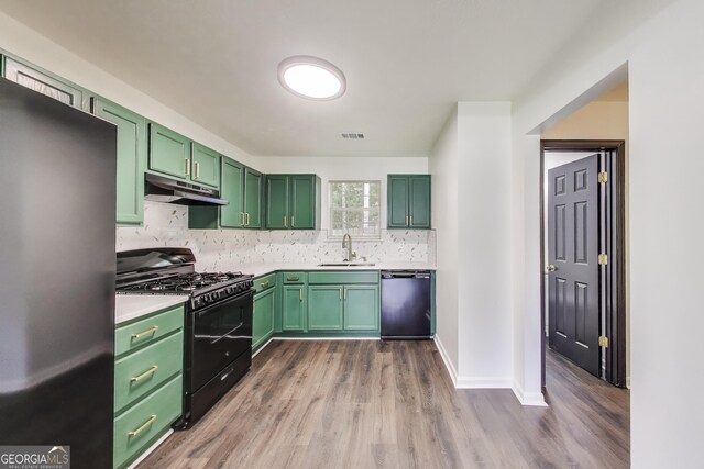 131 Turning Pt, Stockbridge, GA 30281 - kitchen with freestanding refrigerator, black range with gas cooktop, green cabinets, dishwashing machine, and under cabinet range hood