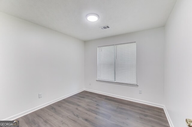 131 Turning Pt, Stockbridge, GA 30281 - unfurnished room featuring dark wood finished floors and baseboards