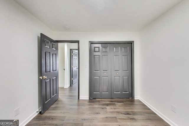 131 Turning Pt, Stockbridge, GA 30281 - unfurnished bedroom with wood finished floors, baseboards, and a closet