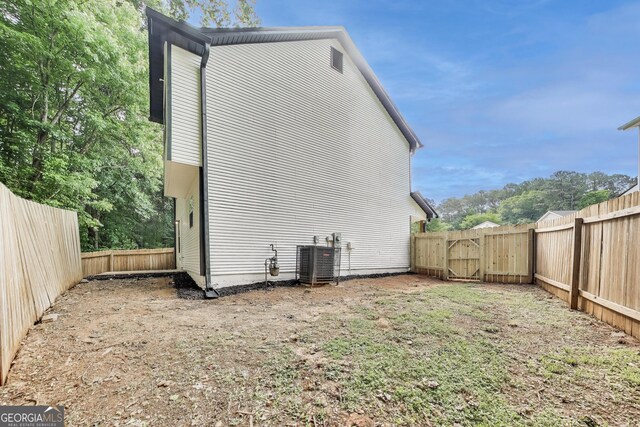 131 Turning Pt, Stockbridge, GA 30281 - view of side of home with a fenced backyard and a gate