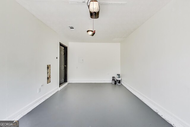 131 Turning Pt, Stockbridge, GA 30281 - empty room with finished concrete floors and baseboards