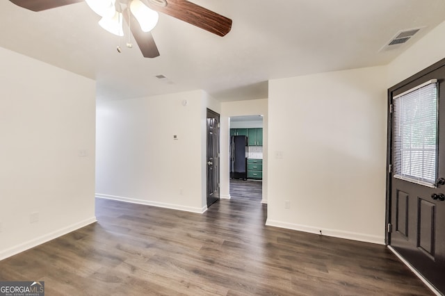 131 Turning Pt, Stockbridge, GA 30281 - spare room with ceiling fan, dark wood-type flooring, and baseboards