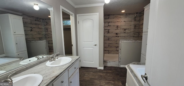4373 Whiporwill Rd, Gillsville, GA 30543 - bathroom with double vanity, a tile shower, a bath, wood finished floors, and crown molding