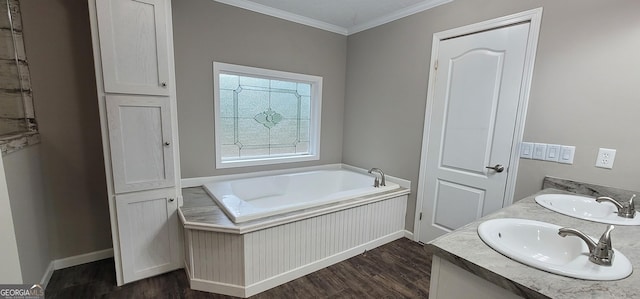 4373 Whiporwill Rd, Gillsville, GA 30543 - bathroom with wood finished floors, crown molding, a garden tub, baseboards, and double vanity