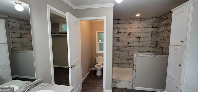 4373 Whiporwill Rd, Gillsville, GA 30543 - bathroom with a tile shower, wood finished floors, vanity, crown molding, and baseboards