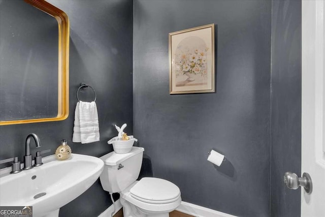 3400 Dencrest Ct SE, Smyrna, GA 30080 - bathroom featuring a sink, toilet, and baseboards
