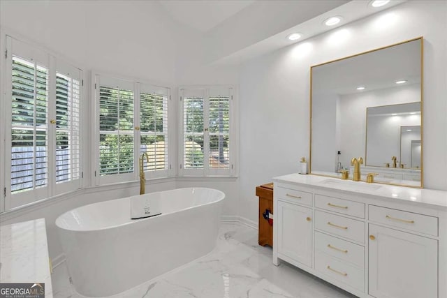 3400 Dencrest Ct SE, Smyrna, GA 30080 - bathroom with vanity, a soaking tub, recessed lighting, marble finish floors, and baseboards