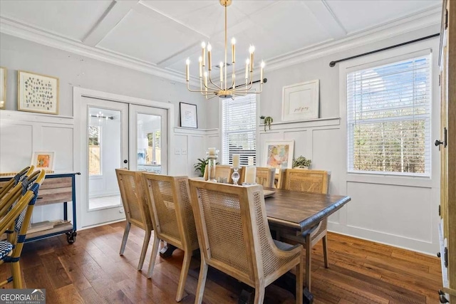 2291 Mission Oak Ter, Grayson, GA 30017 - dining area with a decorative wall, a chandelier, ornamental molding, coffered ceiling, and wood finished floors