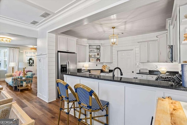 2291 Mission Oak Ter, Grayson, GA 30017 - kitchen featuring open shelves, dark wood finished floors, ornamental molding, appliances with stainless steel finishes, and a peninsula