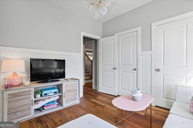 2291 Mission Oak Ter, Grayson, GA 30017 - living area with stairway, wood finished floors, and a chandelier