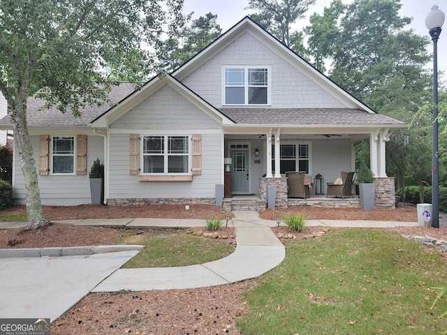 2291 Mission Oak Ter, Grayson, GA 30017 - craftsman inspired home featuring covered porch, a shingled roof, and a front lawn