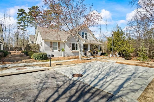 2291 Mission Oak Ter, Grayson, GA 30017 - view of front of home with covered porch and roof with shingles