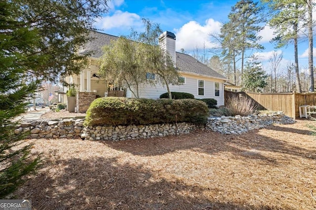 2291 Mission Oak Ter, Grayson, GA 30017 - rear view of property with a ceiling fan, a chimney, and a shingled roof