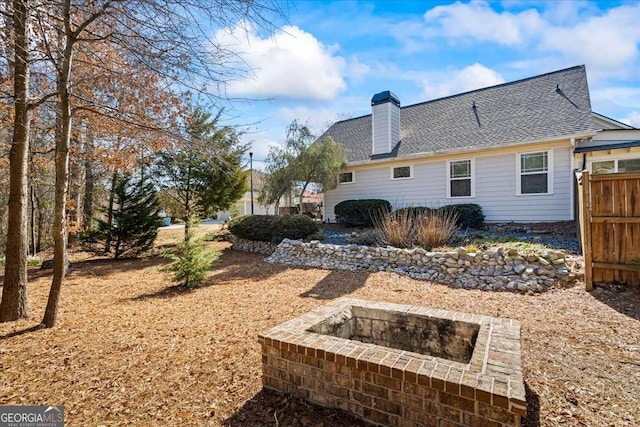 2291 Mission Oak Ter, Grayson, GA 30017 - back of property featuring a chimney and roof with shingles
