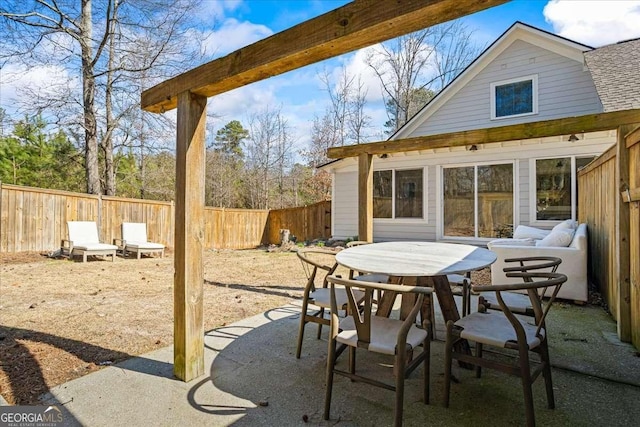 2291 Mission Oak Ter, Grayson, GA 30017 - fenced backyard featuring a patio and outdoor dining space