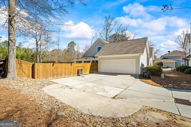 2291 Mission Oak Ter, Grayson, GA 30017 - view of property exterior with a garage and concrete driveway