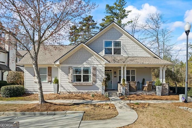2291 Mission Oak Ter, Grayson, GA 30017 - view of front of house featuring a porch and a shingled roof
