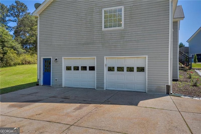 107 Timothy Ln, Bethlehem, GA 30620 - view of side of home with an attached garage, concrete driveway, and a yard