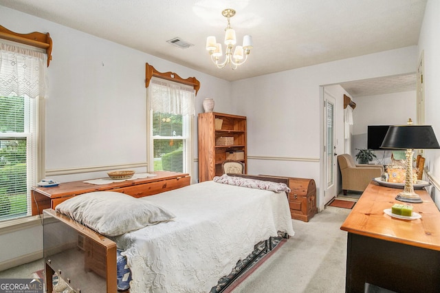 844 Potomac Pl, Winder, GA 30680 - bedroom with a chandelier, light colored carpet, and baseboards