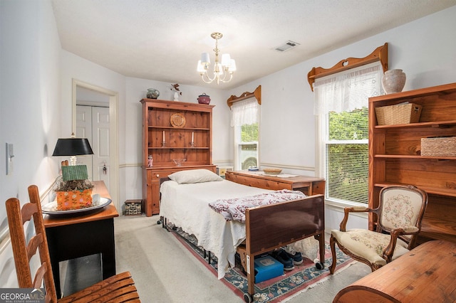 844 Potomac Pl, Winder, GA 30680 - bedroom featuring light colored carpet and a chandelier