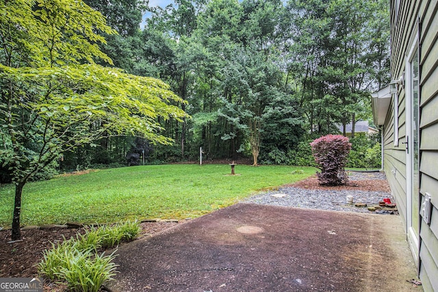 844 Potomac Pl, Winder, GA 30680 - view of grassy yard featuring a patio area
